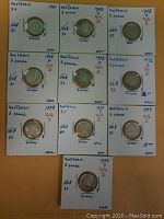 10 Australian silver three pence coins from 1941 to 1943 in individual labeled holders, arranged in a 3x3 grid with one below.