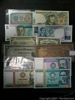 Lot of twelve world banknotes including Bulgaria, Poland, Philippines and Peru. Shows front and back of some notes.