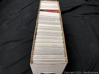 White long cardboard storage box filled with bagged and boarded comic books