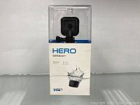Front of sealed retail packaging showing GoPro HERO Session camera mounted