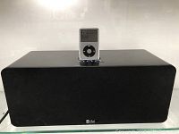 Front view of black rectangular speaker dock with iPod inserted