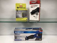 Front view of Ryobi Bluetooth Garage Speaker Module and RotoZip RotoSaw boxes on a shelf.