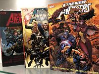 Photo showing three Avengers graphic novels standing upright with covers visible.