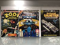 Front covers of '2001 Space Odyssey', 'Close Encounters of the Third Kind', and 'Battlestar Galactica' Marvel Treasury Special Edition comics.
