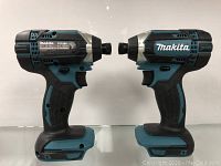 Two Makita cordless impact drivers side by side, showing overall profile and design