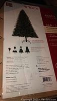 Box label of Holiday Living 7.5 ft artificial Christmas tree showing model number 0783209 and manufacturing details.
