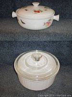 Two casserole baking dishes shown with lids, one ceramic with colorful fruit and butterfly design, one CorningWare with clear glass lid, both in clean condition