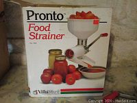 Photo of the original Villa Ware Pronto Food Strainer Model 300 box with images of tomatoes, jars, and strainer usage on front.