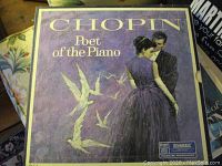 Chopin Poet of the Piano album cover with a purple tone showing a man and a woman and white cranes.