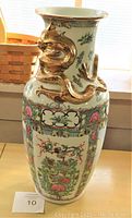 Full view of the vase showing its shape, size, and main gold dragon design with surrounding painted patterns.