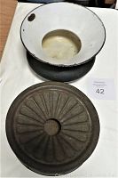 Top and side view of both spittoons showing one with enamelled interior and another with plain cast iron base and decorative lid.