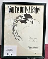 Frontal image of framed vintage sheet music "You're Only A Baby" showing full illustration and text.
