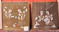 Pair of framed silk prints side-by-side showing Asian traditional dancers in earthly-toned costumes and headpieces