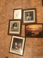 Five framed pictures arranged on a wall showing all included prints and frames.