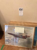 Photo of stacked framed Air Canada airplane prints with bamboo-look wooden frames.