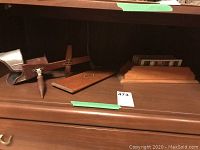 Monarch wooden stereoscope, box lid and slides arranged on wooden shelf