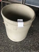 Full view of 10-gallon beige ceramic pot with '10 Imperial' embossed on side and light surface wear.
