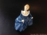 Front and slightly angled view of Royal Doulton figurine 'Fragrance' in blue dress