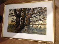 Full front view of the framed watercolor painting depicting two pines against a sunset backdrop