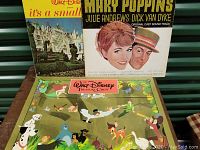 Photo showing Mary Poppins and It's a Small World vinyl record covers and Disney Treasure Chest box with various Disney characters.