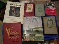 Photo of 7 books including Four Days about the Kennedy assassination, Victorian Poetry and Poetics, and The Past We Share.