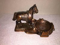 Side view of vintage copper horse figurine and attached ashtray