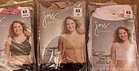 Three new Just My Size bras in package: black, beige, white, all size 6X