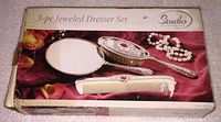 Box showing image and branding of 3-piece jeweled dresser set