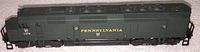 Side view showing length, paint, and lettering detail of the green Pennsylvania diesel locomotive model.