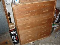 Exterior view of oak wooden tool chest with five drawers and recessed handles
