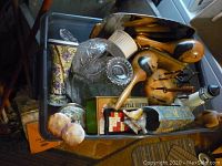 Overview of lot showing wooden bird figurines, glassware, ceramic figurines, bottle cutter box, decorative vase and sundry items in storage bin