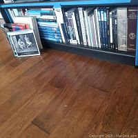 Shelf with assorted hardcover photobooks and music books