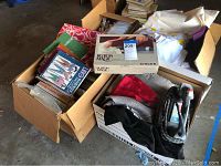 Boxed Singer Button Magic button sewer along with sewing and design books and assorted folded fabric in large boxes.