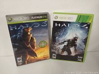 Front covers of Halo 3 and Halo 4 Xbox 360 game cases.