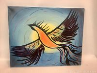 Front view of abstract painting showing stylized bird with extended wings on blue circular background.