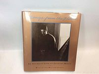 Front cover of the book 'Songs From The Hills' featuring a sepia-toned portrait of a man and the title in stylized text.