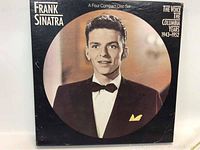Front cover of the four CD set box featuring a black and white photo of young Frank Sinatra in formal wear with bow tie and pocket square.