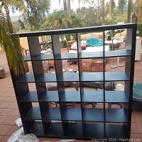 Front view of shelving unit showing 25 cubed compartments in a 5x5 grid.