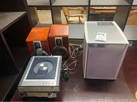 Full lot showing DVD Micro Theater player, amplifier, two wooden speakers, and JVC subwoofer.