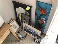Photo showing stained glass panel, beveled mirror, wall art artworks, slate Uncle Sam plaque and Sydney Harbour ceramic framed tiles