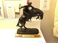 Front view of full sculpture on marble base with nameplate