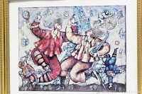 Close-up of colorful clown-themed framed print with Eiffel Tower and abstract background.