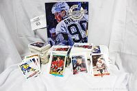 Full view of multiple stacks of loose hockey trading cards and a booklet with player illustration