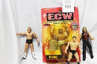 Four wrestling figures displayed, Pivot Punch Sabu figure in original package and three loose figures: Edge, Billy Gunn, Bradshaw.