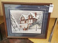 Front view of framed Walter Campbell print showing a winter scene with a horse-drawn carriage in front of a snowy Victorian house.