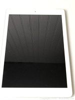 Front view of the iPad showing black touchscreen and white bezel.