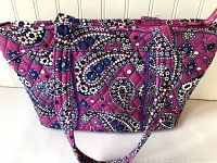 Front view of Vera Bradley handbag showing the pink paisley pattern and two handles