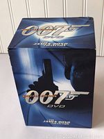 Closed blue box with 007 logo and James Bond image on it, indicating the collection is a James Bond DVD box set.