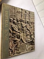 Cover of book titled Imperial Rome with relief sculpture design and beige cloth spine