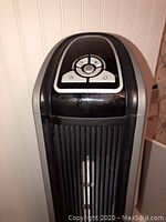 Close-up of the Lasky tower heater showing digital control panel and buttons on top.